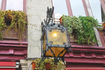Lantern on the facade of old French house 
