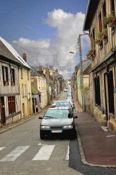 Row of parked cars on the street of Verneuil-sur-Avre. France