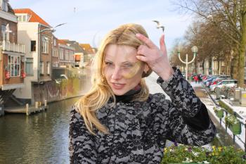 Girl on the waterfront in the Dutch town of Gorinchem. Netherlands 