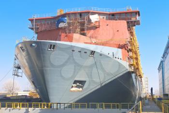 The construction of a new ship in dry dock shipyard