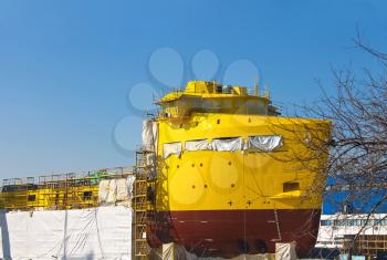 The construction of a new ship in dry dock shipyard