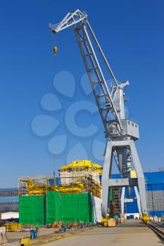 Crane and ship under construction at the shipyard