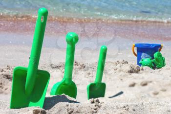 Children sand toys on the beach near the sea