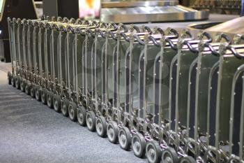 Row of luggage carts at the airport arrival hall