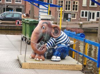 AMSTERDAM,THE NETHERLANDS - FEBRUARY 18, 2012 :  Sculpture elephant sailor on the docks of pleasure boats  in Amsterdam . Statue of Simon, a part of the art exhibition Elephant Parade , held in the fa