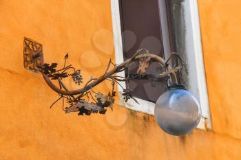 Lantern on the facade of old italian house. Venice 