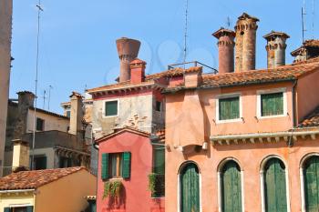 Facades of houses on a street in Venice, Italy 