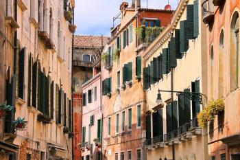 VENICE, ITALY - MAY 06, 2014: House on a narrow street in Venice, Italy