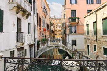Picturesque Italian houses on a narrow canal in Venice, Italy 