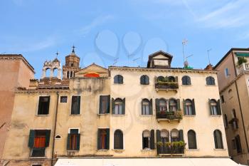 Picturesque Italian house on a background of  Church Santa Maria Gloriosa dei Frari, Venice, Italy