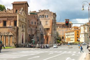 ROME, ITALY - MAY 03, 2014: People on  street near the picturesque ancient building in Rome, Italy