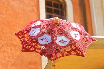 Lacy parasol for women on the counter  street vendors of souvenirs in Venice, Italy