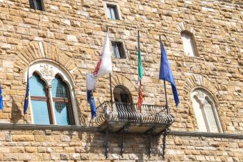 Flags on the balcony of the Palazzo Vecchio. Florence, Italy 