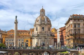 ROME, ITALY - MAY 04, 2014: Ruins of the Forum of Trajan on background of the church Holy Name of Mary and of Trajan's Column in Rome, Italy
