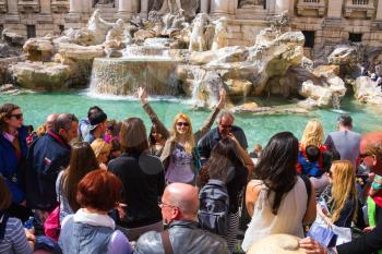 ROME, ITALY - MAY 04, 2014: Tourists near the Trevi Fountain in Rome, Italy
