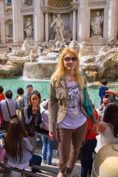 ROME, ITALY - MAY 04, 2014: Tourists near the Trevi Fountain in Rome, Italy
