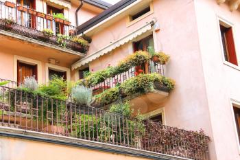 Picturesque Italian house with flowers on terrace