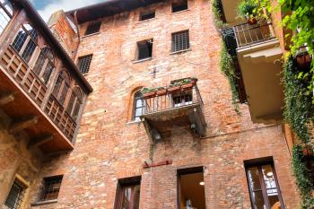 Windows and balconies in the museum courtyard Juliet. Verona, Italy