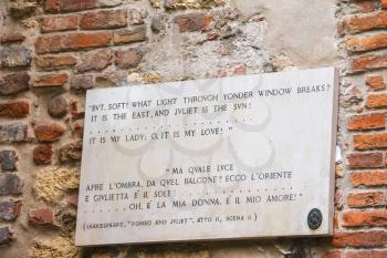 VERONA, ITALY - MAY 7, 2014: Memorial plaque on wall of the house Juliet in Verona, Italy