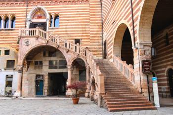 VERONA, ITALY - MAY 7, 2014: Staircase of reason in courtyard  the Palazzo della Ragione in Verona, Italy