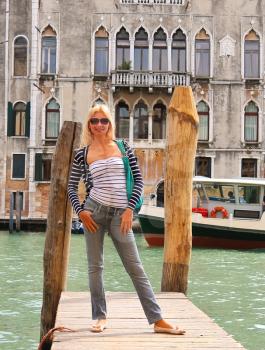 Attractive girl  on a bridge in Venice, Italy
