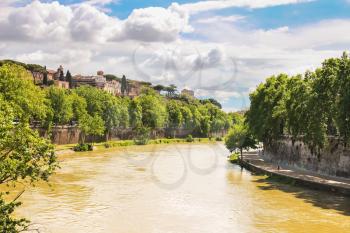 ROME, ITALY - MAY 03, 2014: People on the picturesque waterfront of the Tiber River in Rome, Italy