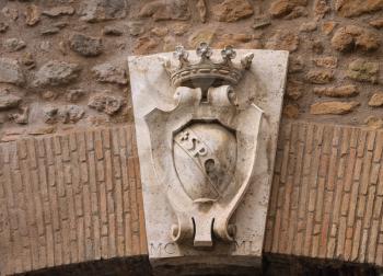 Coat of arms on a gate in the wall around the Vatican. Rome, Italy