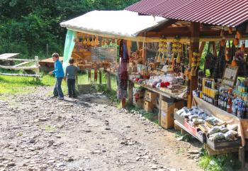 Village Urych , Lviv region. Ukraine - July 1, 2014 : Tourists buy souvenirs in the historical and cultural reserve Tustan