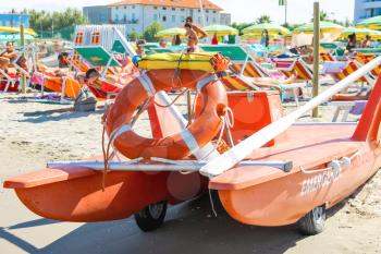 Bellaria Igea Marina, Rimini, Italy - August 14, 2014: Safety equipment on the beach. Lifebuoy and a belt on catamaran in the resort town Bellaria Igea Marina, Rimini