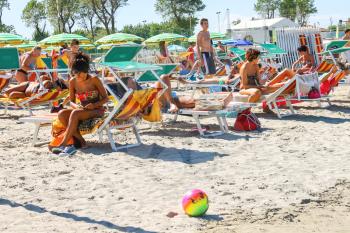 Bellaria Igea Marina, Rimini, Italy - August 14, 2014: Tourists sunbathe on  beach in the resort town Bellaria Igea Marina, Rimini