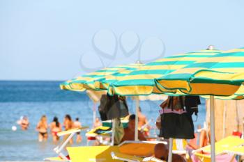 Bellaria Igea Marina, Italy - August 14, 2014: Sunbeds and umbrellas on the beach in the resort town Bellaria Igea Marina, Rimini, Italy