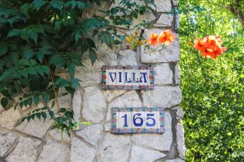 Bellaria Igea Marina, Rimini, Italy - August 14, 2014: Colorful signboard with number on the house in the resort town Bellaria Igea Marina, Rimini