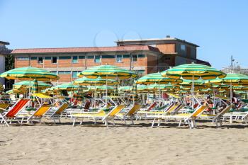 Bellaria Igea Marina, Rimini, Italy - August 14, 2014: Tourists sunbathe on  beach in the resort town Bellaria Igea Marina, Rimini