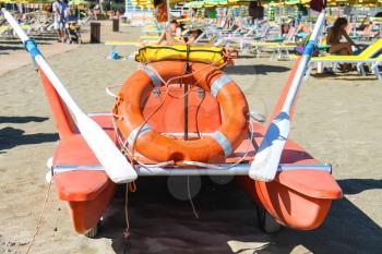 Bellaria Igea Marina, Rimini, Italy - August 14, 2014: Safety equipment on the beach. Lifebuoy and a belt on catamaran in the resort town Bellaria Igea Marina, Rimini
