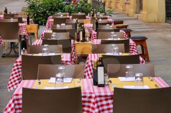 Serving tables in the  Italian outdoor  restaurant.