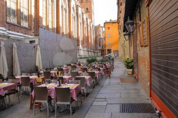 Bologna, Italy - August 18, 2014: Tables of restaurant Zerocinquantuno on Via De'Pignattari in Bologna. Italy