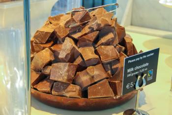 Amsterdam Schiphol, Netherlands - April 18, 2015: Chunks of milk chocolate on display cafes at the airport Amsterdam Schiphol, Netherlands