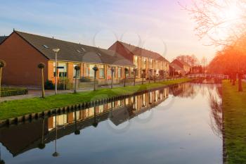 Picturesque houses on the canal in Meerkerk, Netherlands