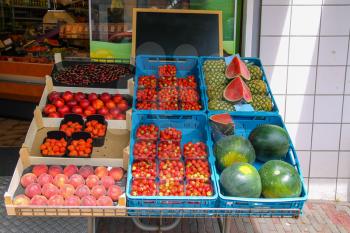 Shelf with fresh fruits in greengrocery store in Zandvoort, the Netherlands