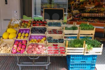 Shelf with fresh fruits and herbs in greengrocery store in Zandvoort, the Netherlands