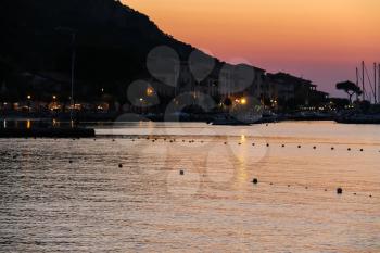 Boats anchored in the small port of Marciana, Elba Island, Italy on the sunset