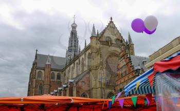 Exhibition sale in the Grote Markt in Haarlem. View to the Grote Kerk (Sint-Bavokerk). The Netherlands