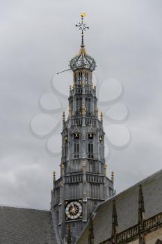 The bell tower of the Grote Kerk (Sint-Bavokerk) in the  historic center of Haarlem, the Netherlands