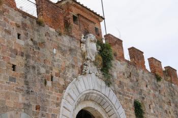 Antique fortified wall and gate in Pisa, Italy
