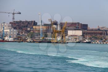 Industrial area with port facilities on the coast of Tyrrhenian Sea. Piombino, Italy
