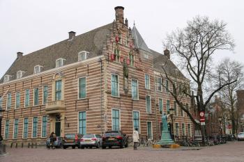 Utrecht, the Netherlands - February 13, 2016: Old building with statue in historic city centre