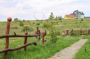 Old wooden fence near empty way in Ukraine
