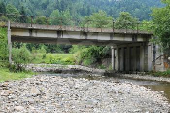 Automobile bridge over small river in the Carpathians, Ukraine