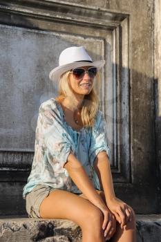 Pretty woman in white hat in Venice, Italy