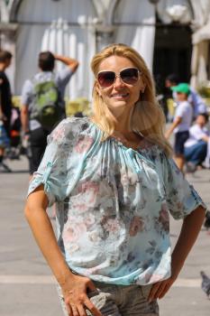 Pretty woman with long blond hair in Venice, Italy